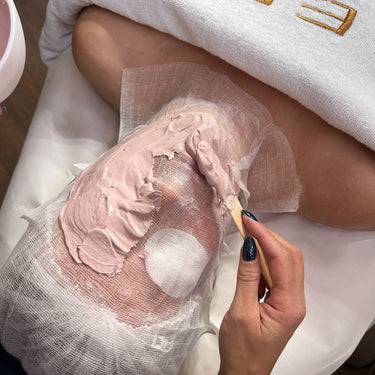 Person receiving a facial treatment with a sculpting mask.